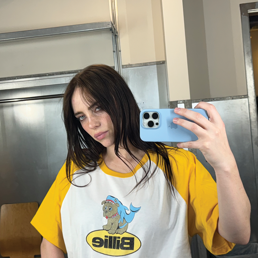 Billie wearing Shark Raglan Tee
