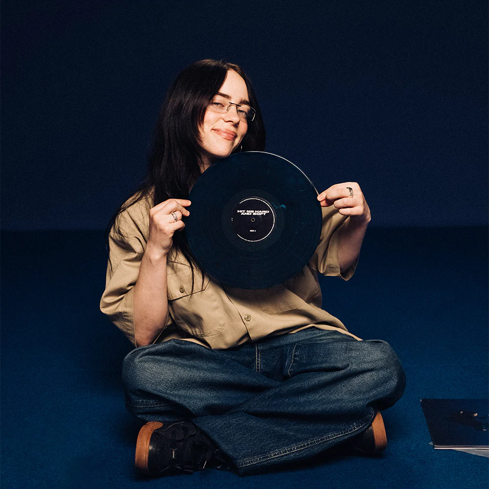 Billie holding HIT ME HARD AND SOFT Exclu. Vinyl