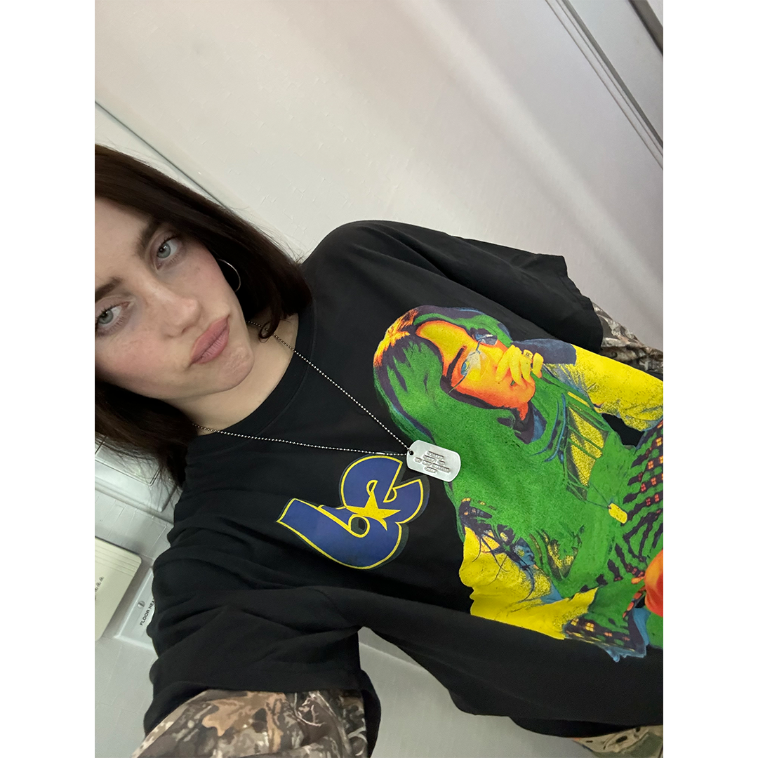 BILLIE WEARING HIT ME HARD AND SOFT TOUR CAMO LAYERED LONG SLEEVE TEE FRONT