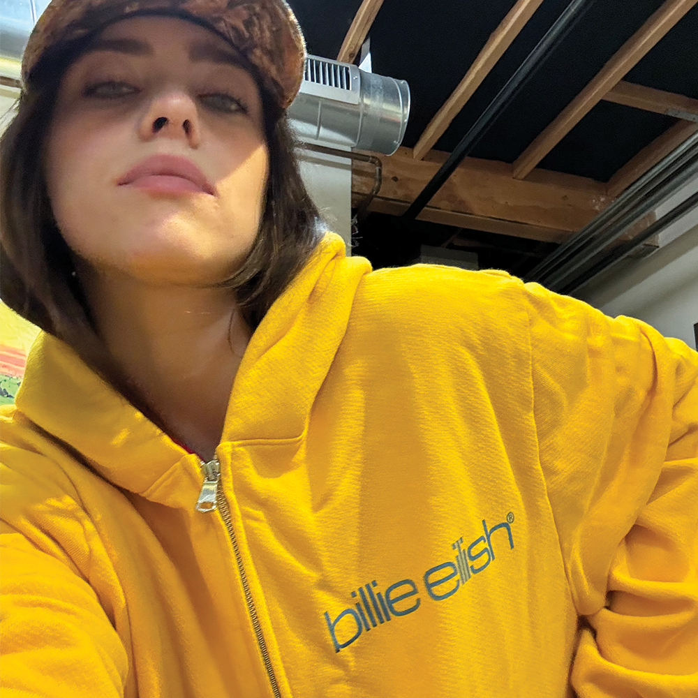 Billie wearing Billie Yellow Zip Hoodie Front